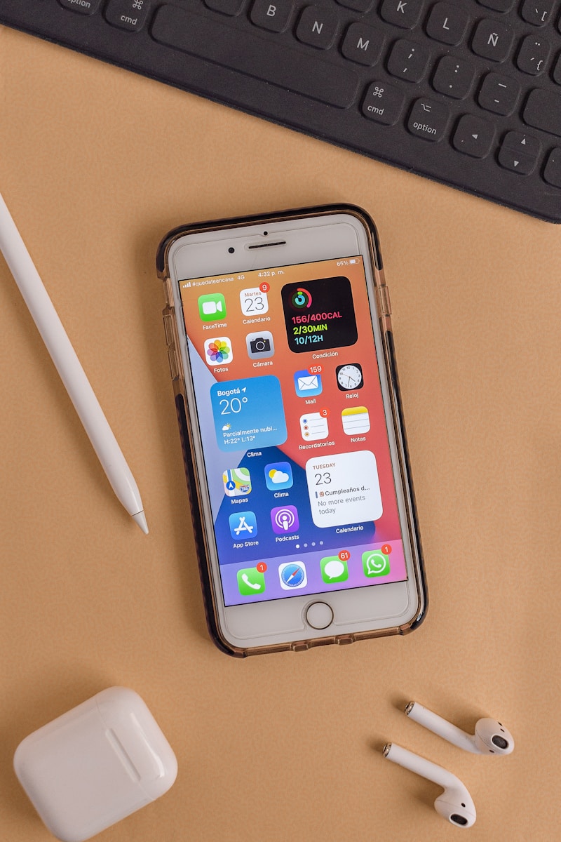 silver iphone 6 on brown wooden table